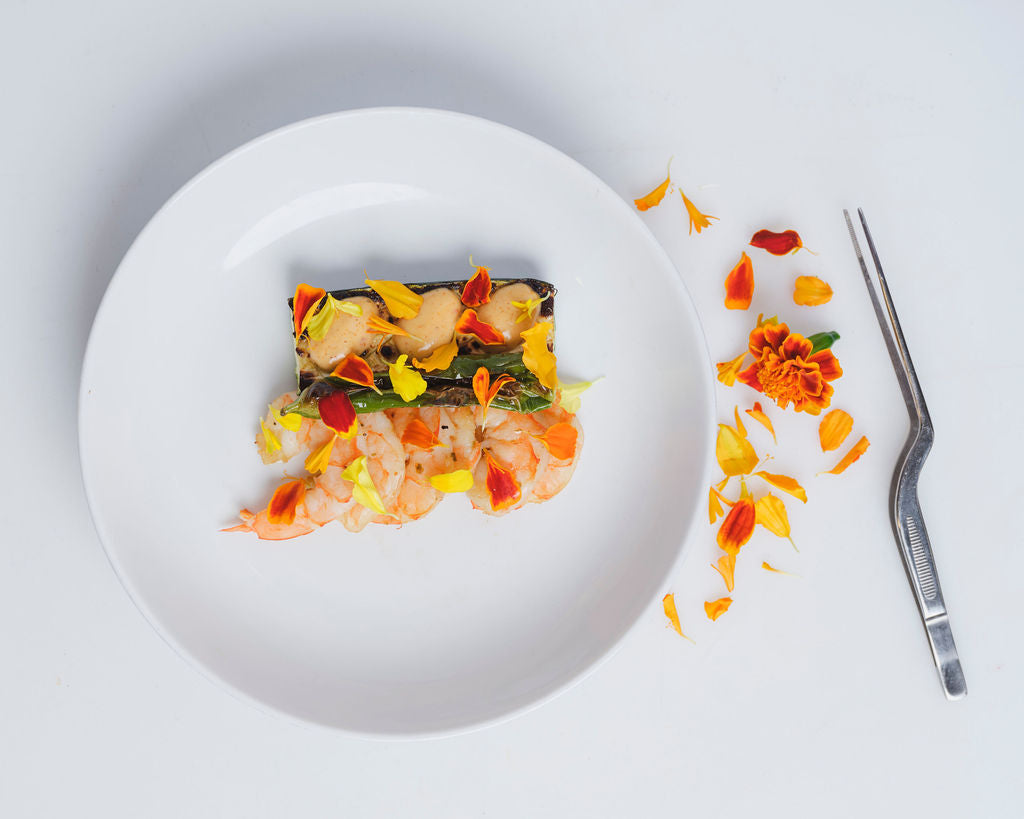 Marigold Petals on gourmet dish – bright edible garnish from Long Island, NY for NYC chefs